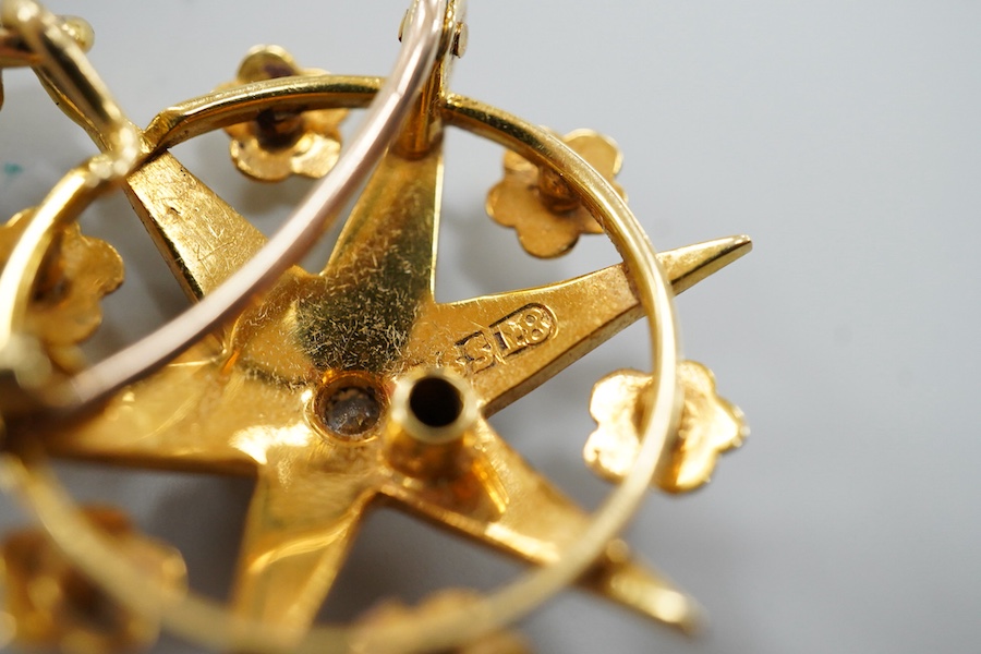 A Victorian yellow metal (stamped 18), diamond and graduated split pearl set star pendant brooch, makers mark SS, 39mm including the bale, gross weight 5.2 grams, with fitted box.